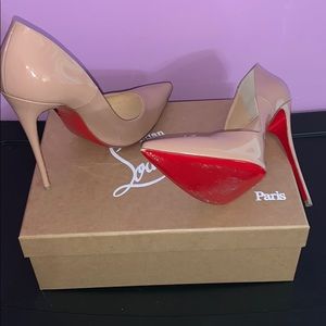 Christian Louboutin So Kate nude patent heels.